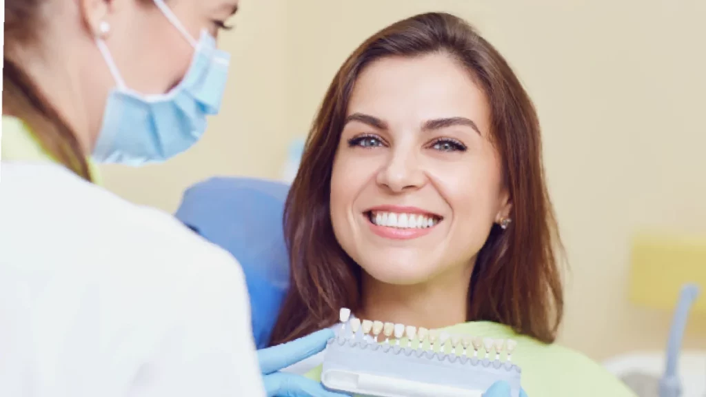 Smiling woman in a dental chair during a dental crown in Annapolis, MD