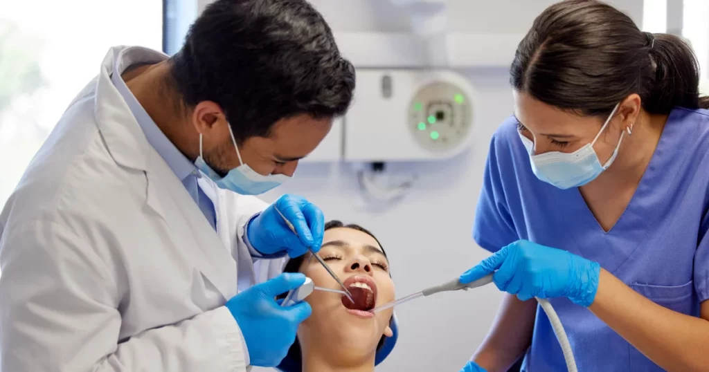Dental Fillings procedure by dentist and assistant in Annapolis, MD dental clinic