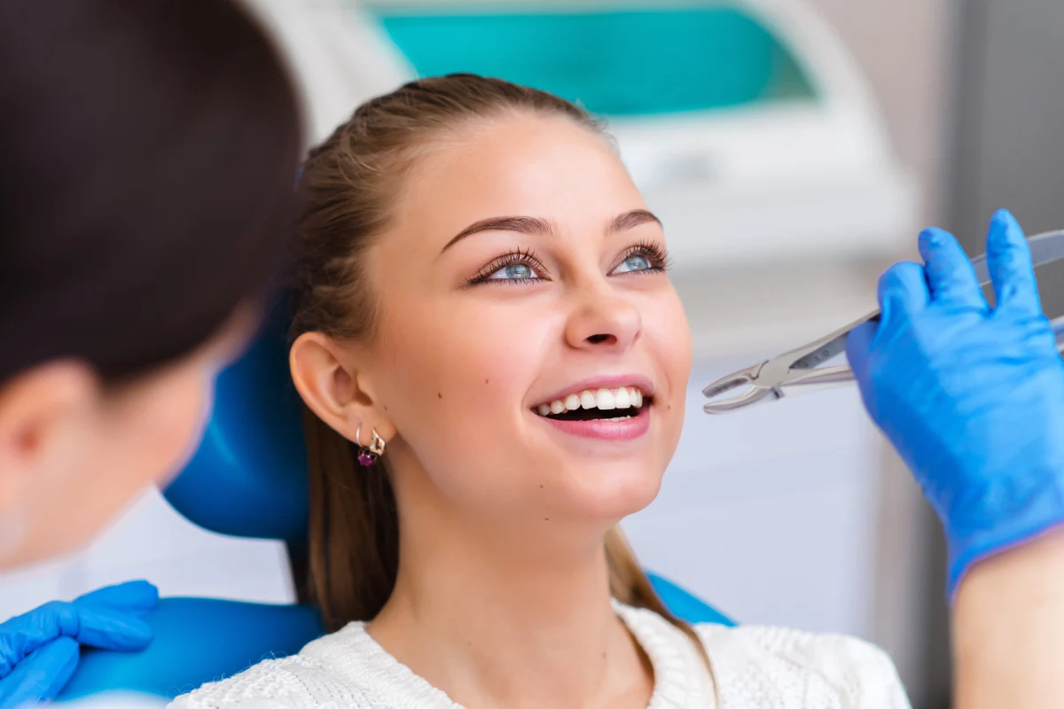 Woman receiving comfortable tooth extraction in Annapolis at Annapolis Cosmetic and Implant Dentistry